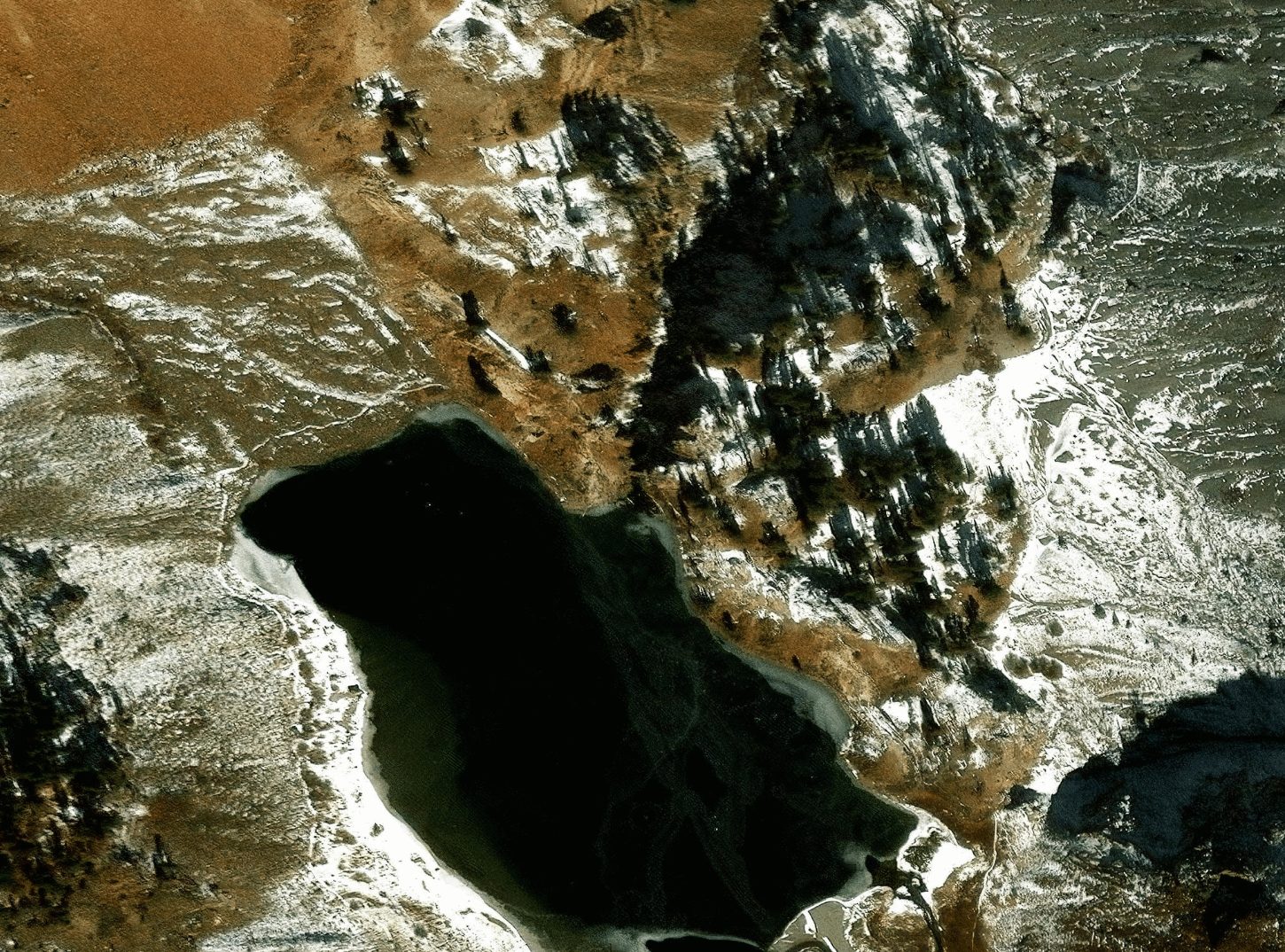 Esri World Imagery crop of the same bridge node, snow-covered
