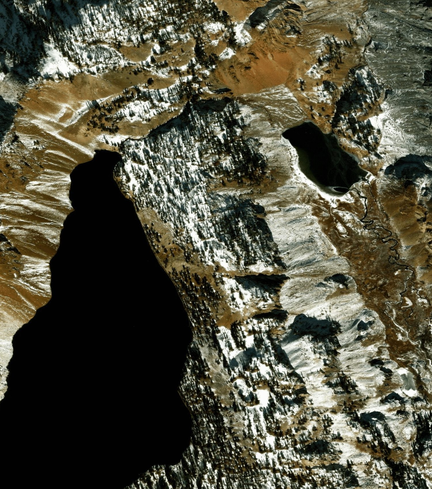 Esri World Imagery of the same corridor, snow-covered and shadowed